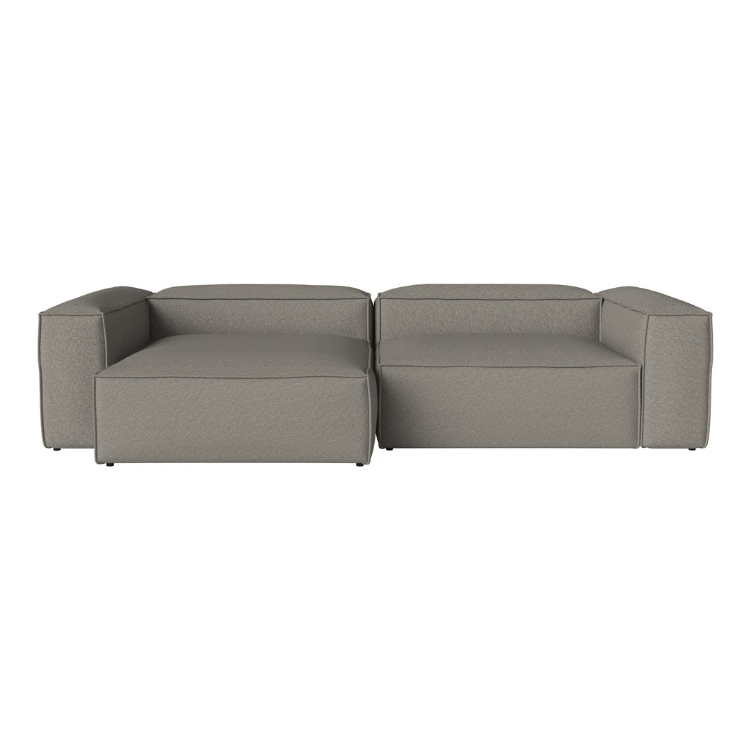 Modern gray sectional sofa with sleek lines and a minimalist design, perfect for contemporary living spaces.