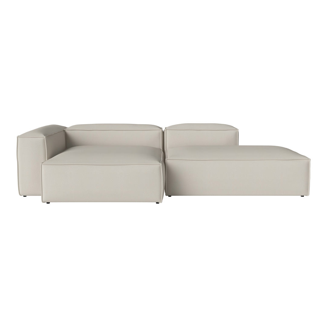 Modern light gray sectional sofa with sleek, minimalist design and smooth fabric texture, perfect for contemporary decor.