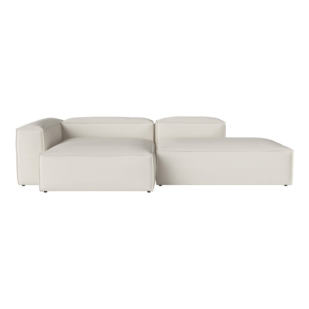 Modern off-white sectional sofa with clean lines and a smooth, minimalist design. Perfect for any contemporary space.