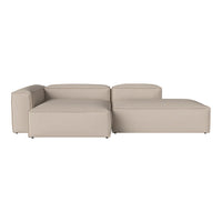 Light beige sectional sofa with a smooth, modern design and clean lines, perfect for minimalist decor.