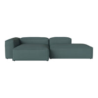 Teal sectional sofa with a smooth, modern design and subtle textured fabric. Ideal for contemporary interiors.