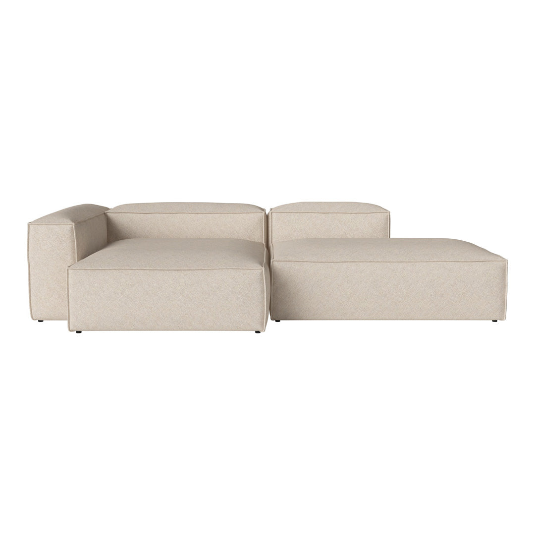 Beige sectional sofa with a textured fabric and minimalist design, featuring clean lines and soft angles.