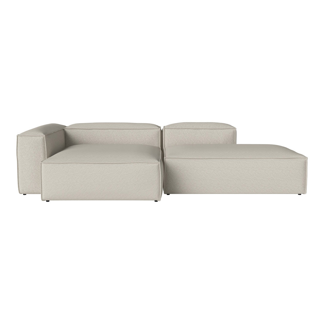 Modern beige sectional sofa with a sleek, minimalist design and smooth, textured upholstery.