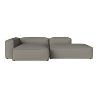 Modern grey sectional sofa with a sleek design and smooth fabric upholstery, featuring minimalist lines and no patterns.