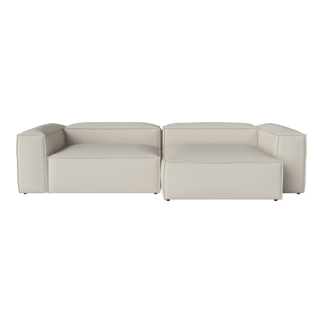 Modern sectional sofa in soft light gray leather with clean lines and minimalistic design, perfect for stylish interiors.