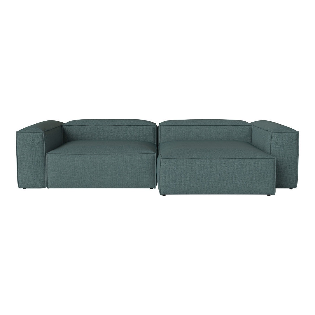 Teal modular sofa with sleek, minimalist design and textured fabric. Perfect for modern living spaces.
