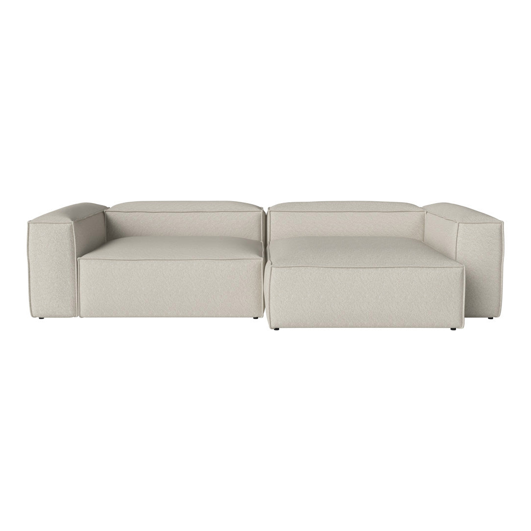 Beige modular sofa with a smooth, minimalist design and clean lines, perfect for modern living spaces.
