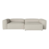 Beige modular sofa with a smooth, minimalist design and clean lines, perfect for modern living spaces.