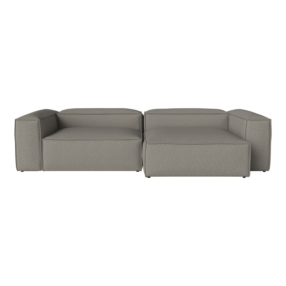 Modern gray sectional sofa with a minimalist design and smooth fabric upholstery, perfect for contemporary living spaces.