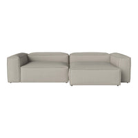 Modern gray sectional sofa with a minimalist design, featuring clean lines and a soft, textured fabric.
