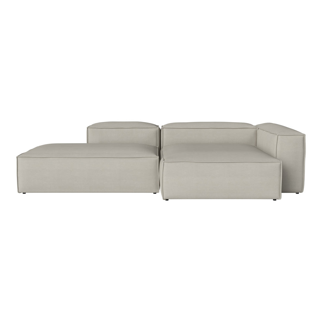 Light gray sectional sofa with a smooth, contemporary design, featuring clean lines and no visible patterns.