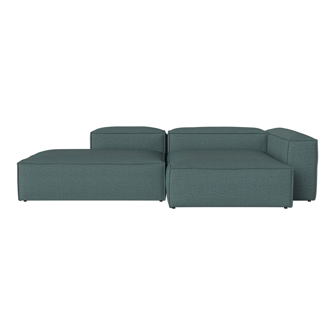 Teal sectional sofa with a smooth, modern design, featuring a solid color and minimalistic patterns.