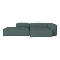 Teal sectional sofa with a smooth, modern design, featuring a solid color and minimalistic patterns.