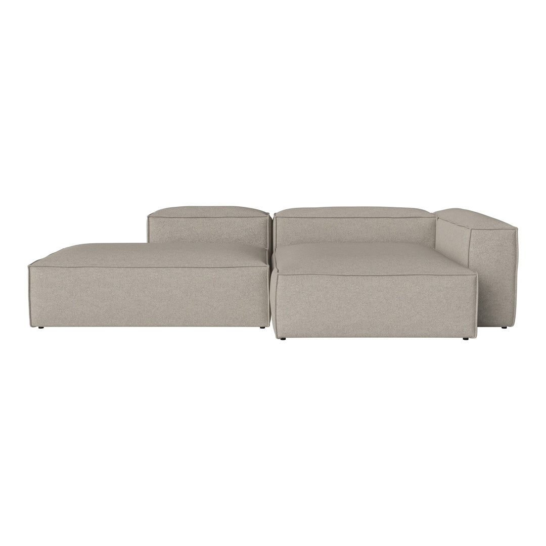 Light beige sectional sofa with a smooth, modern design and clean lines, perfect for contemporary living spaces.