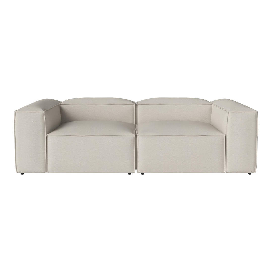 Light beige modular sofa with a modern, minimalist design and smooth, solid upholstery.