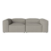 Gray modular sofa with a minimalist design and smooth fabric texture, perfect for modern living spaces.