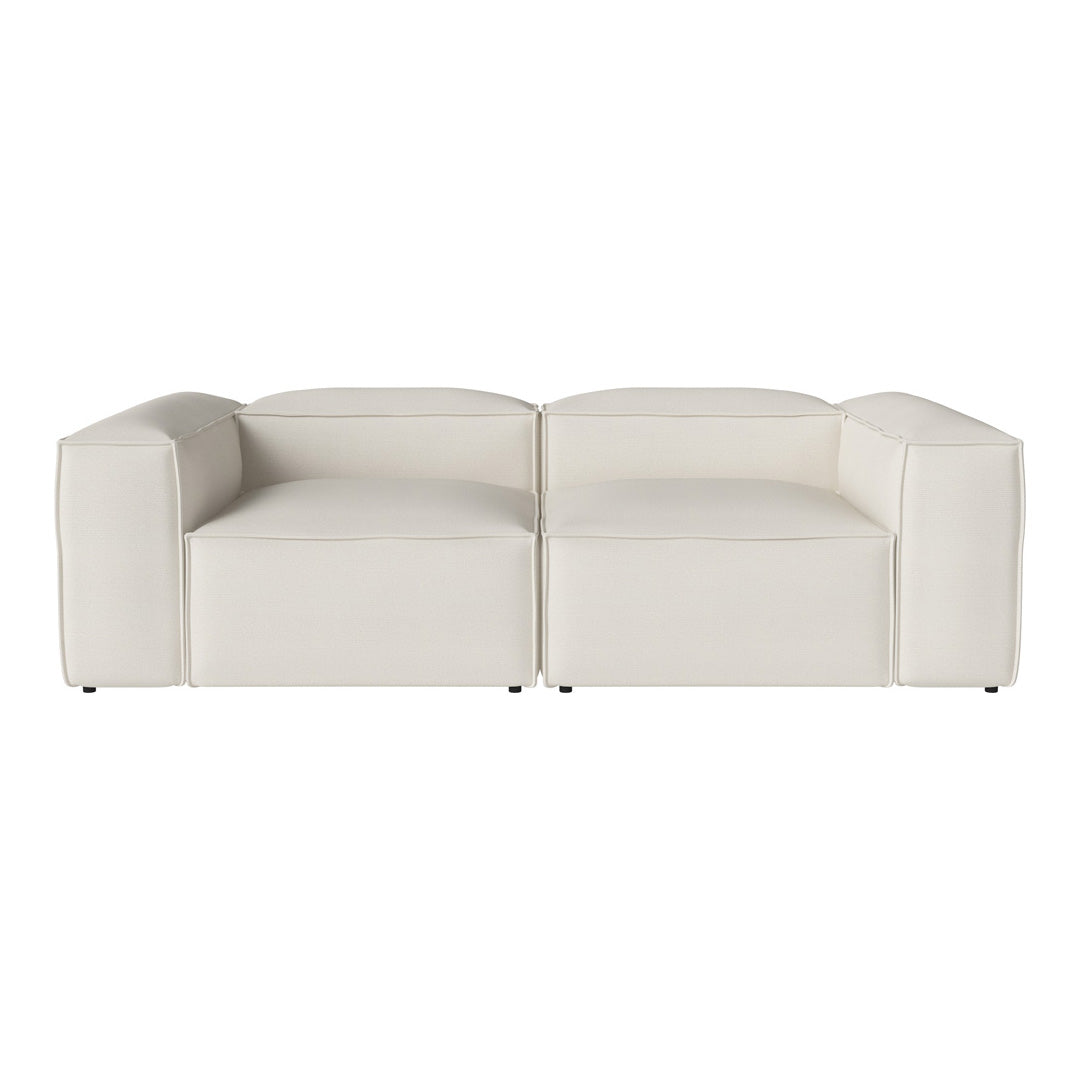 Modern white modular sofa with sleek lines and minimalist design, perfect for stylish living spaces.