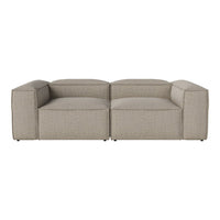 Beige modular sofa with a smooth textured fabric and clean, modern lines, perfect for contemporary living spaces.