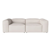 Modern two-tone white sofa with a sleek, minimalist design and smooth, solid surface. Perfect for contemporary decor.