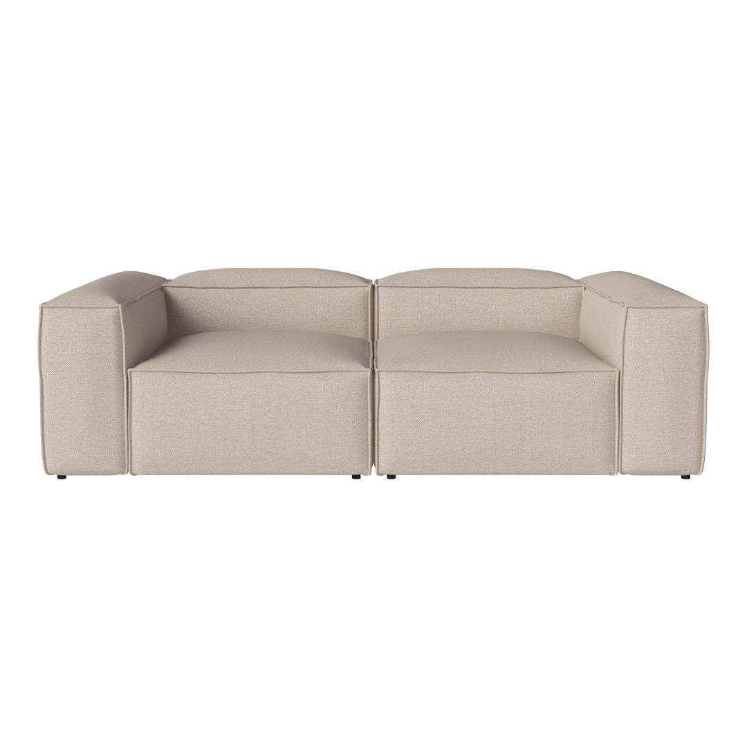 Beige modular couch with a minimalist design and subtle textured fabric, perfect for versatile living spaces.
