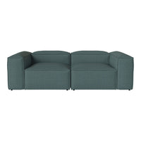 Teal lounge sofa with a modern, minimalist design and textured fabric, perfect for contemporary interiors.