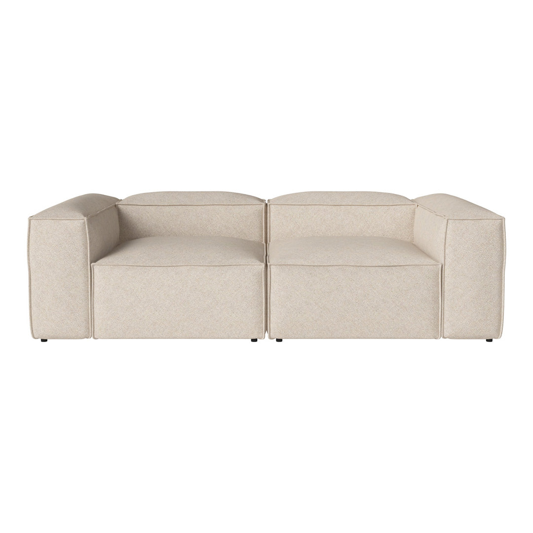 Beige block-style sectional sofa with smooth, minimalistic design and subtle texture. Perfect for modern interiors.