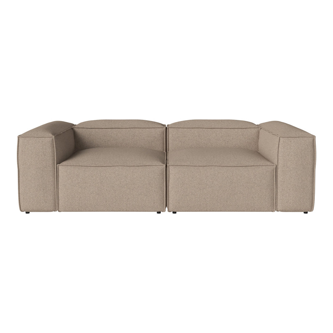 Beige modular sofa with a sleek, minimalist design and textured fabric, perfect for modern living spaces.
