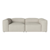 Light beige modular sofa with a smooth texture and contemporary geometric shape. Perfect for modern living spaces.