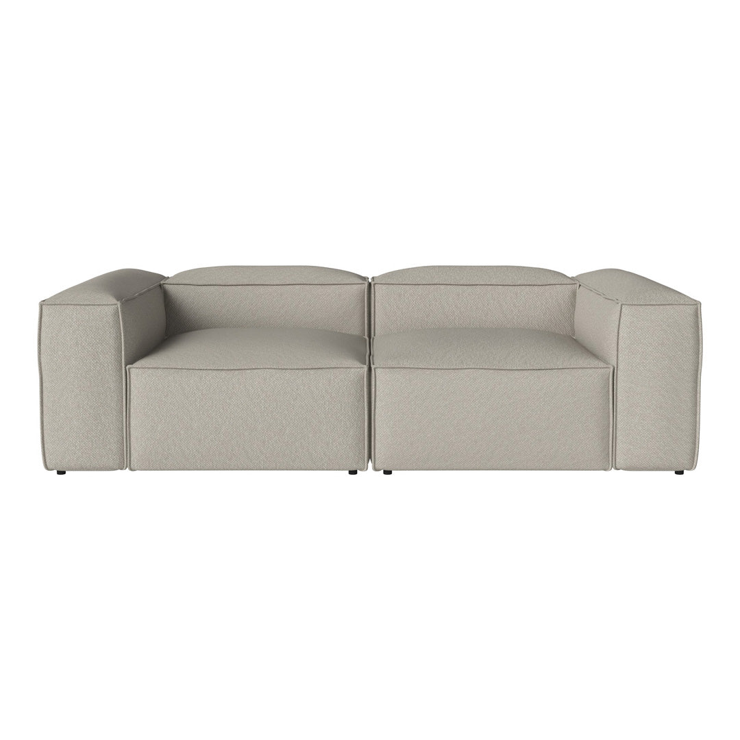 Modern neutral gray sofa with a textured, minimalist design and clean lines, perfect for contemporary interiors.