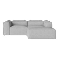 Light gray modular sofa with a smooth, textured fabric and contemporary design, perfect for minimalistic decor.