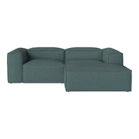 Teal sectional sofa with a minimalist design and textured fabric pattern, perfect for modern living spaces.