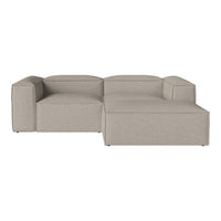 Beige sectional sofa with a minimalist design, featuring solid color upholstery and clean lines.