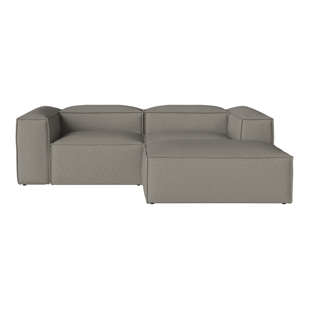 Gray sectional sofa with a modern, minimalist design and soft, textured fabric. Perfect for contemporary interiors.