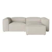 Beige modular sofa with smooth, modern lines, featuring a minimalist design and a sleek, neutral color palette.