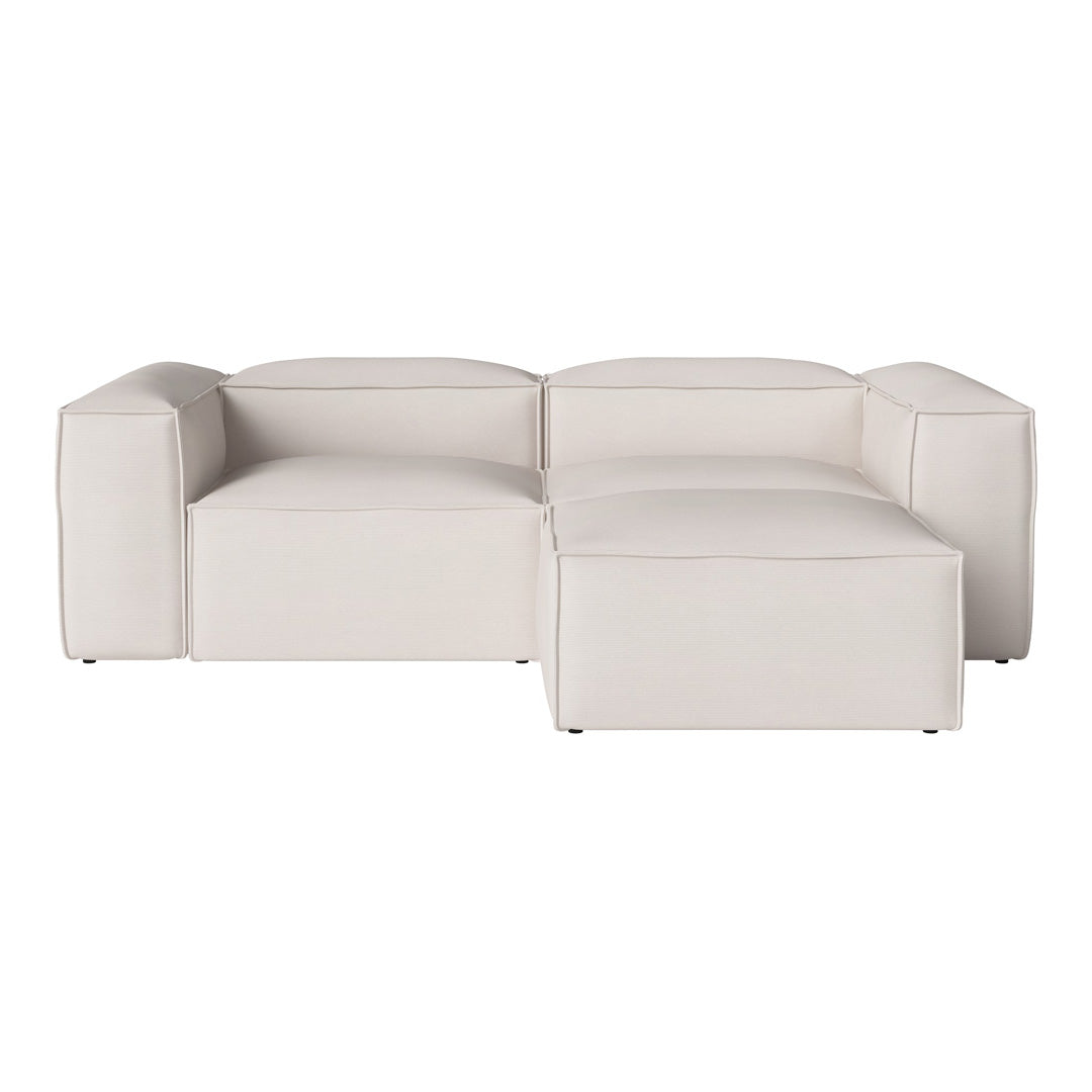 Modular sofa in soft white upholstery with smooth, minimalist design and clean lines for a modern look.