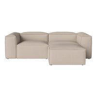 Beige sectional sofa with a sleek, modern design featuring smooth lines and subtle texture. Perfect for any decor.