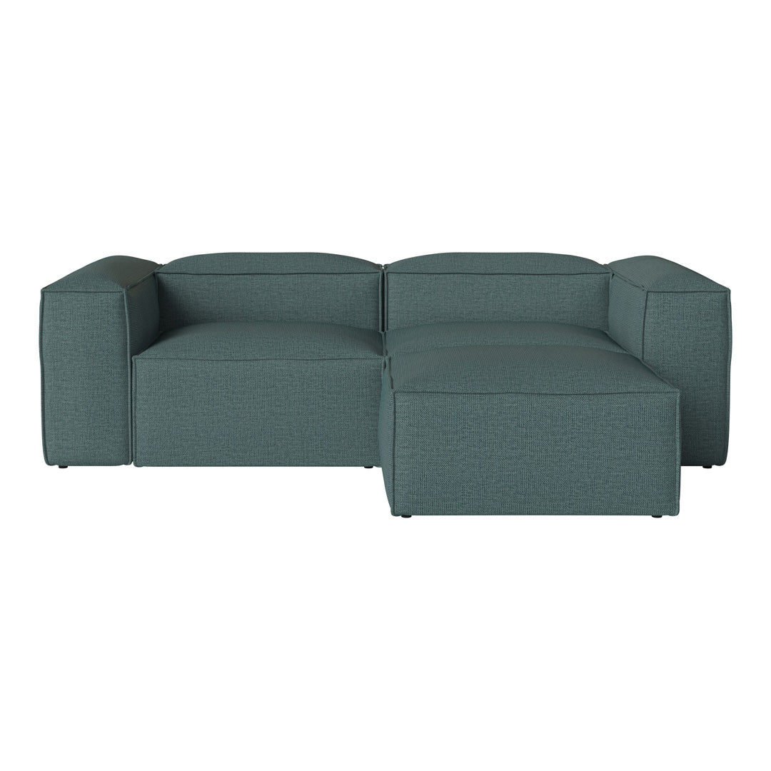 Teal modular sofa featuring a smooth, textured fabric with clean lines for a modern look. Perfect for contemporary interiors.