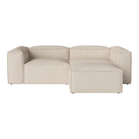 Beige sectional sofa with a modern design, featuring smooth, minimalist lines and subtle texture. Ideal for contemporary decor.