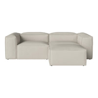 Beige sectional sofa with a smooth, minimalist design and a subtle texture, perfect for modern living spaces.