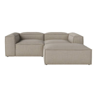 Beige sectional sofa with a minimalist design and soft, textured fabric. Perfect for modern interiors.