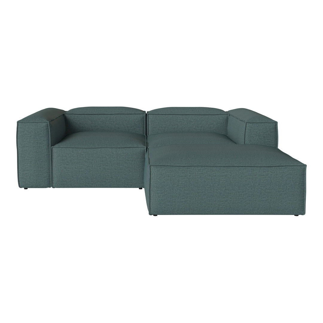 Teal sectional sofa with a textured pattern, featuring clean lines and a modern design for chic living spaces.