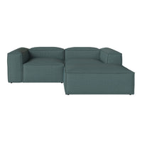 Teal sectional sofa with a textured pattern, featuring clean lines and a modern design for chic living spaces.