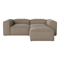 Beige modular sofa with textured fabric and minimalist design, featuring clean lines and neutral tones.