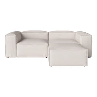 Modern white sectional sofa with sleek lines and minimalist design, featuring a smooth, solid color finish.