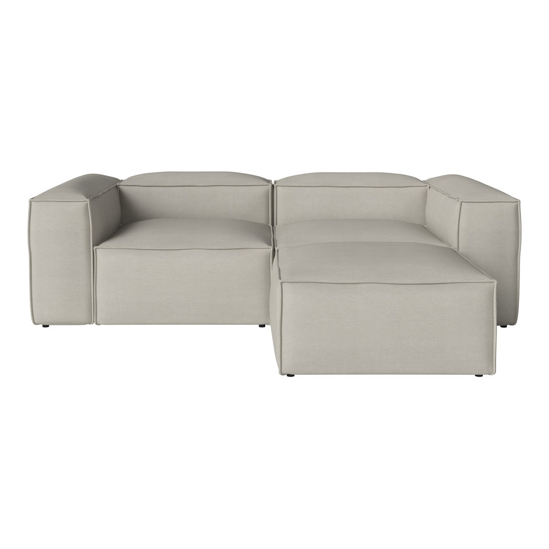 Beige modular sectional sofa with clean lines and a smooth, textured fabric pattern. Ideal for modern living spaces.