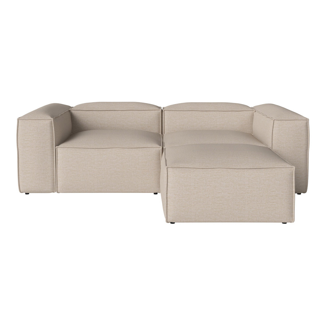 Beige modular sectional sofa with a smooth, textured fabric and a minimalist, modern design.