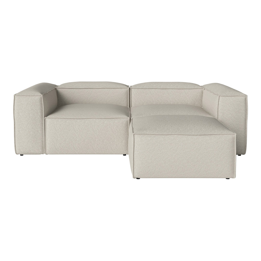 Contemporary beige sectional sofa featuring a textured, minimalist design with clean lines. Perfect for modern spaces.