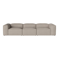 Beige modular sofa with a sleek, minimalist design and smooth fabric texture. Ideal for modern living spaces.