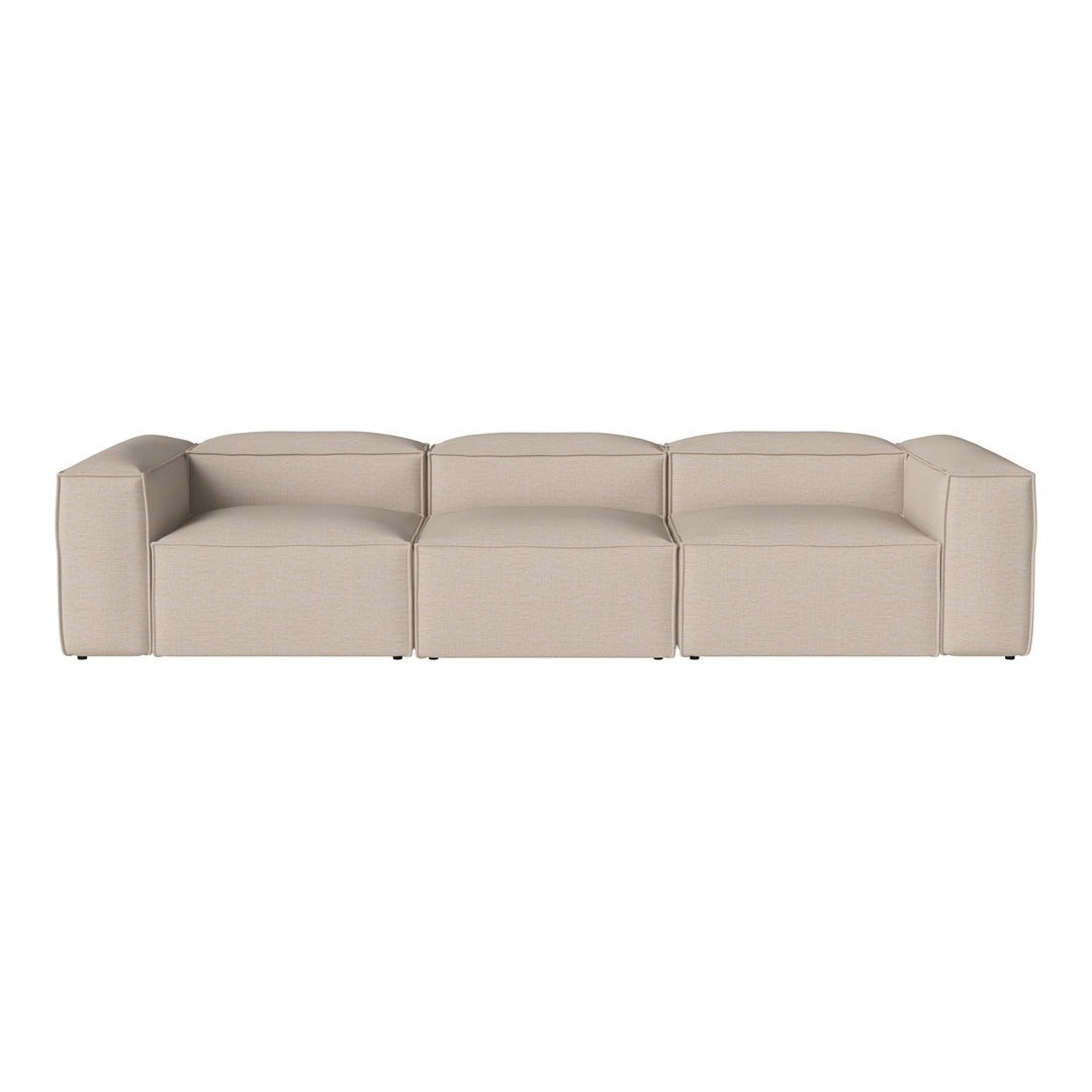 Beige modular sofa with a smooth, minimalist design and no visible patterns, perfect for modern living spaces.