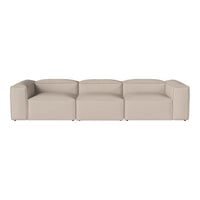 Beige modular sofa with a smooth, minimalist design and no visible patterns, perfect for modern living spaces.
